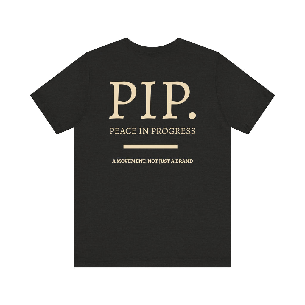 Peace In Progress Tee — PIP. Crew Neck Short Sleeve T‑Shirt