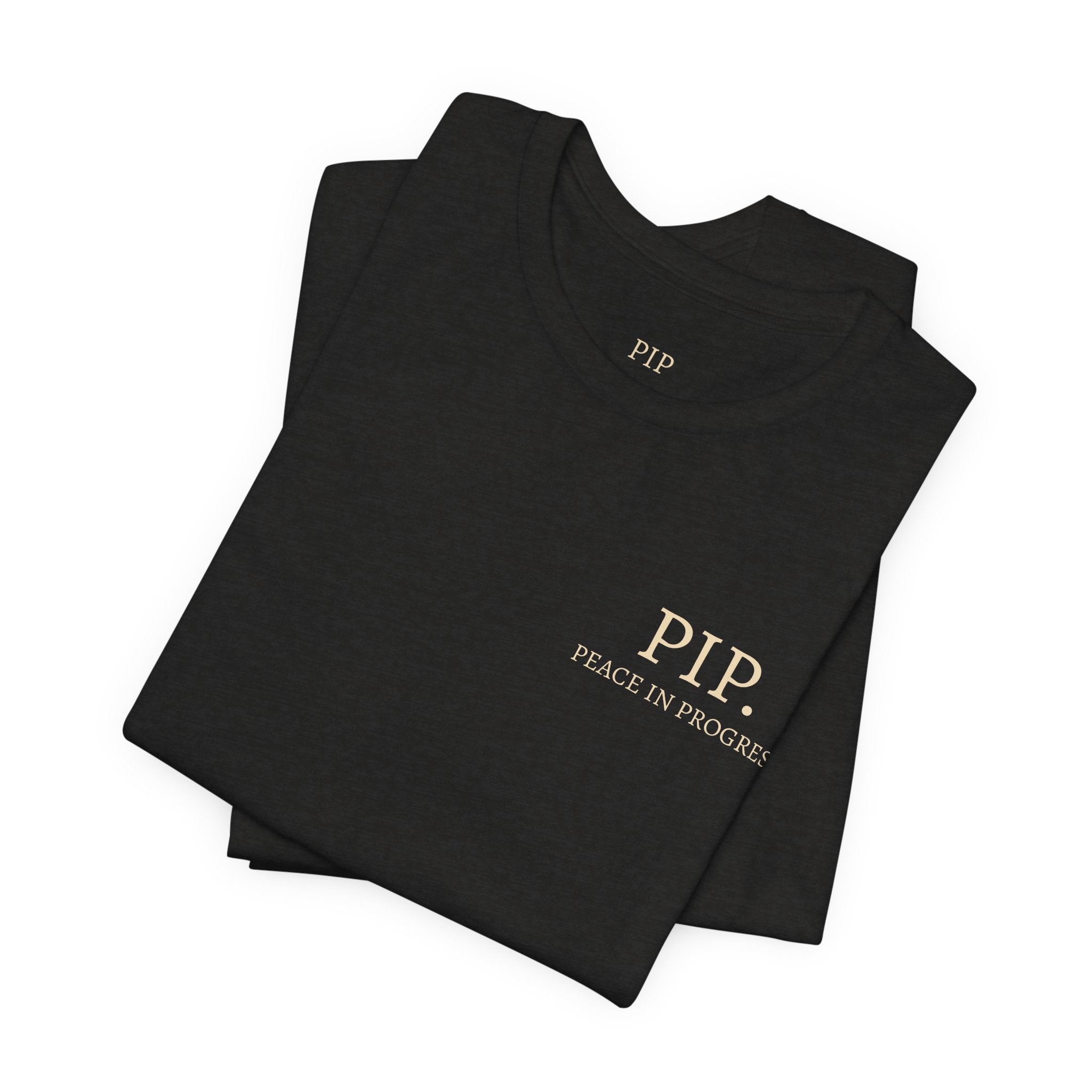 Peace In Progress Tee — PIP. Crew Neck Short Sleeve T‑Shirt