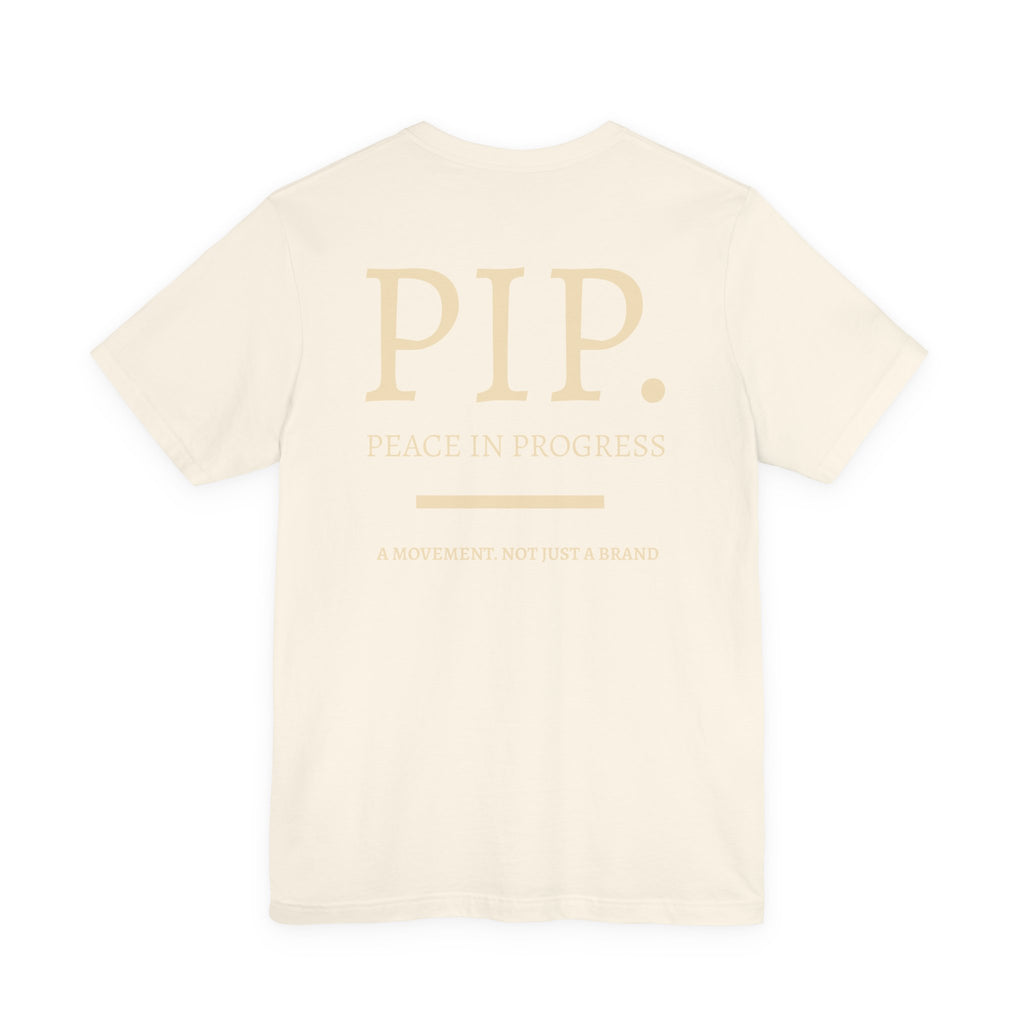 Peace In Progress Tee — PIP. Crew Neck Short Sleeve T‑Shirt