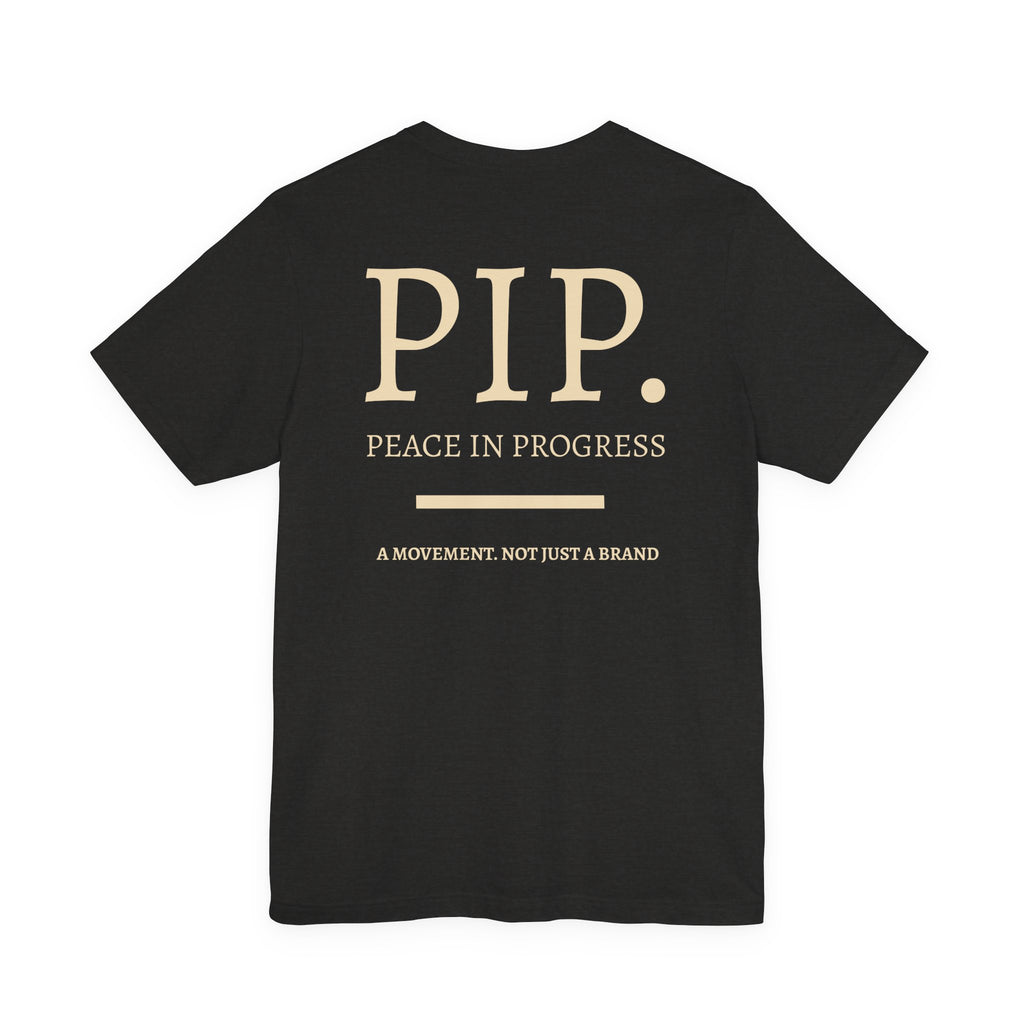 Peace In Progress Tee — PIP. Crew Neck Short Sleeve T‑Shirt