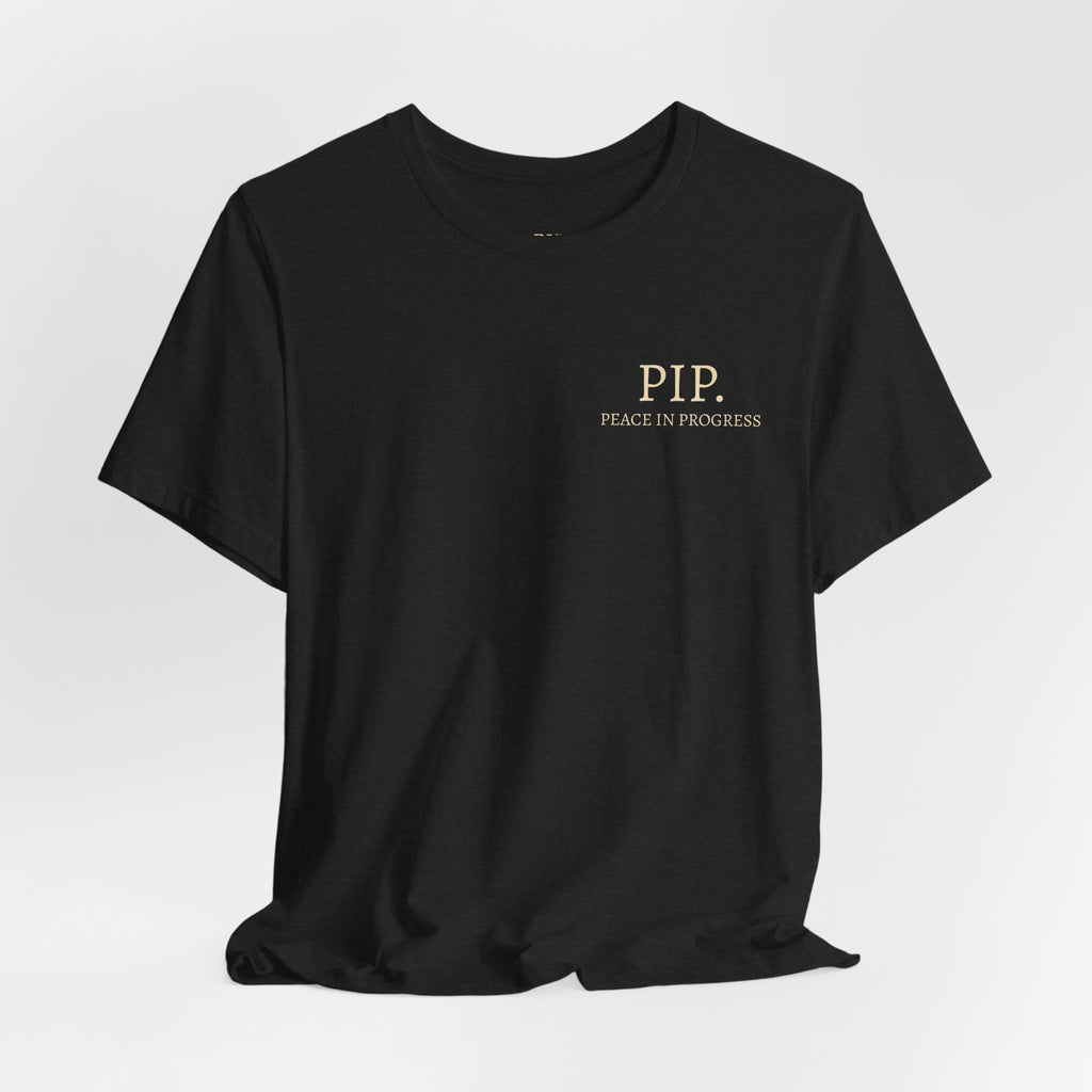 Peace In Progress Tee — PIP. Crew Neck Short Sleeve T‑Shirt
